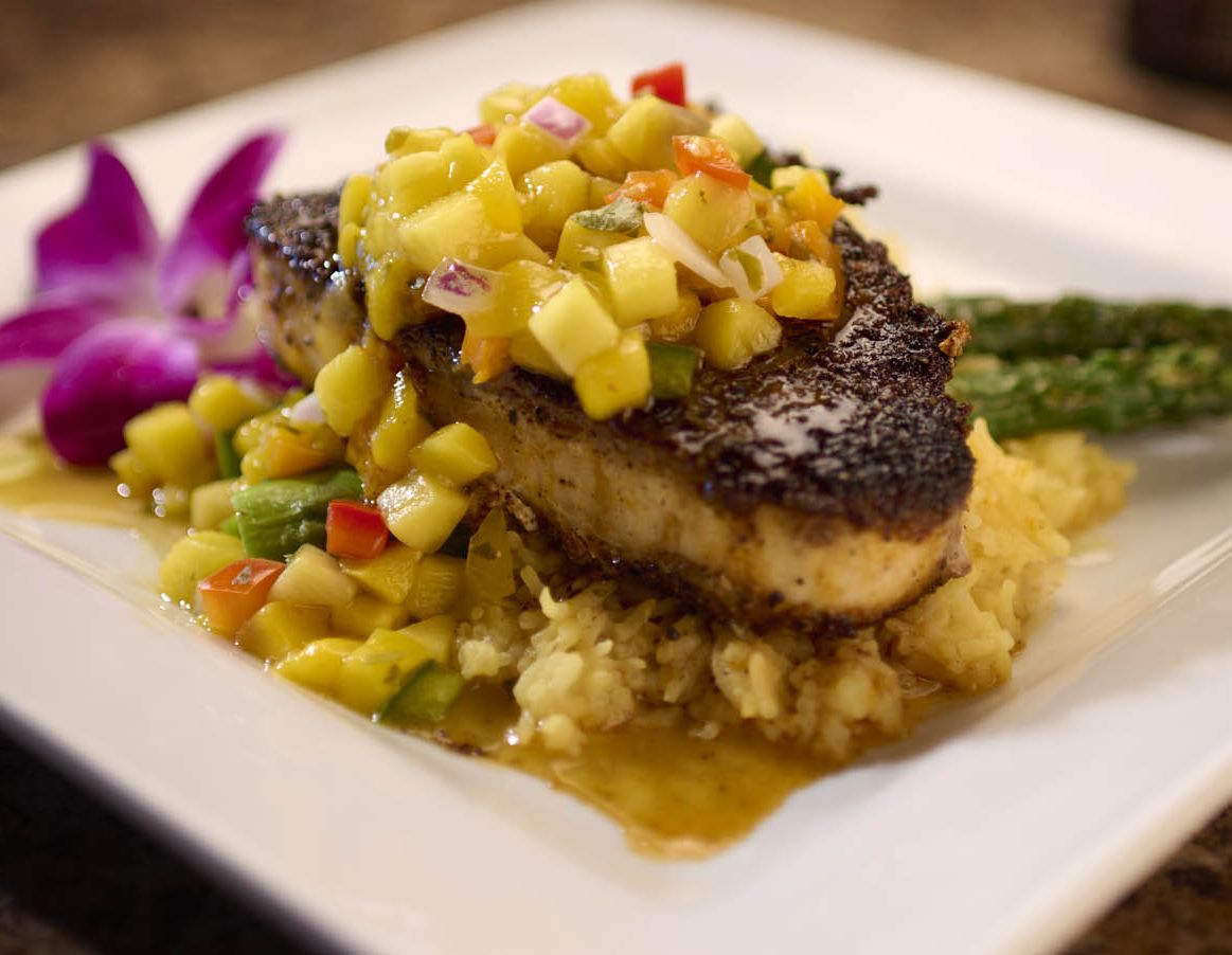 A swordfish steak with colorful garnishes at the Lakehouse Tap & Grille